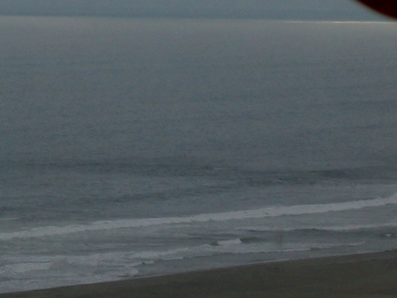 0806200006.JPG - Day 14, Friday, June 20. Enroute by bus from Nazca to Lima on the Pan Am Highway.  A view of the Pacific.